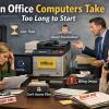 Office staff waiting on slow-starting computers while phones ring and work piles up at the start of a busy workday